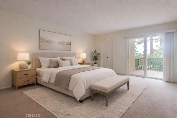 a spacious bedroom with a bed and a large window