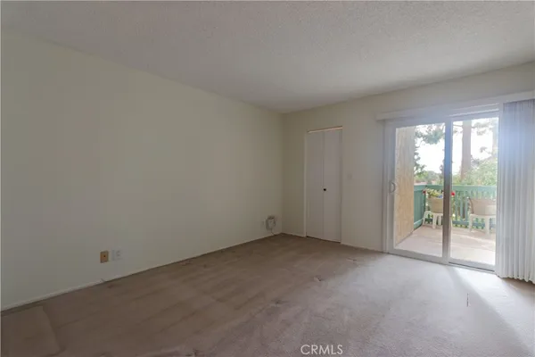 an empty room with glass door