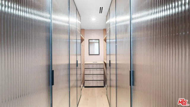 a bathroom with a glass shower door