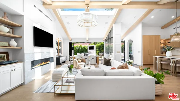 a living room with fireplace furniture and a flat screen tv