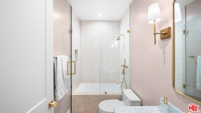 a bathroom with a shower and a toilet