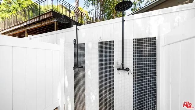 a kitchen that has a lot of cabinets in it and wooden floors