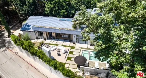 an aerial view of a house with a garden