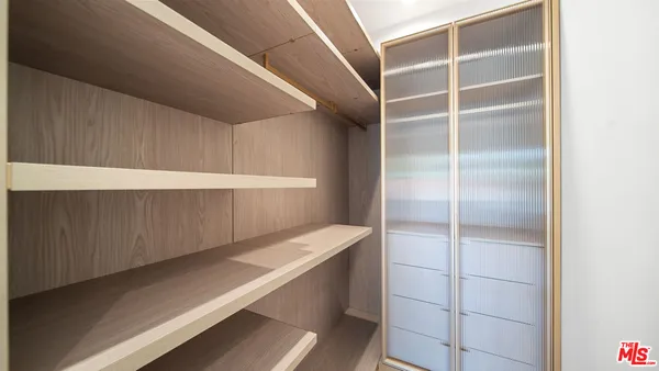 a view of an empty walk in closet