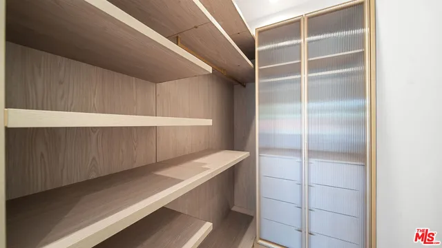 a view of an empty walk in closet