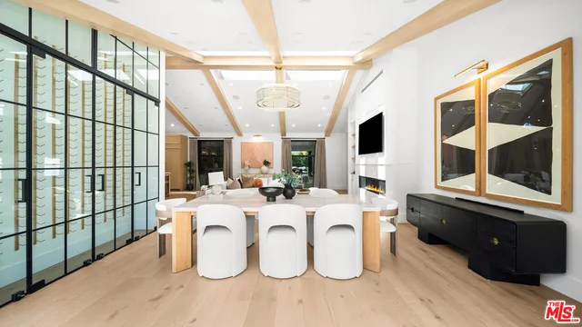 a view of a living room with furniture and flat screen tv