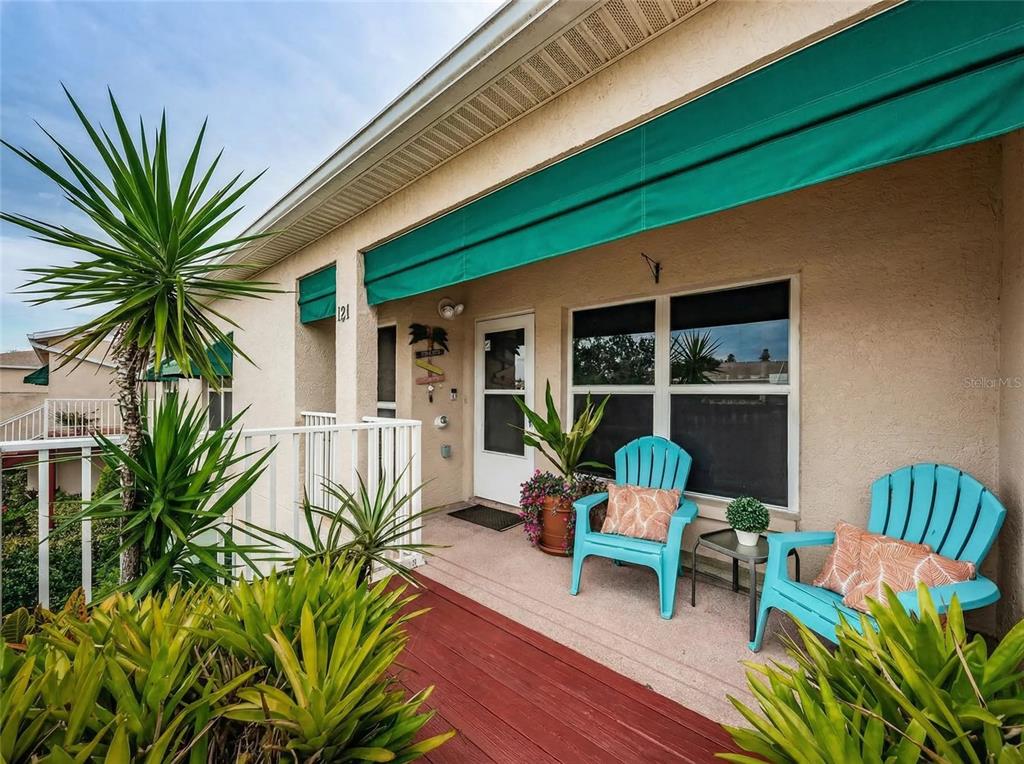 6363 99th Way North, Unit 12I St. Petersburg, FL 33708 - Photo 11 of 69 a balcony with furniture and a potted plant