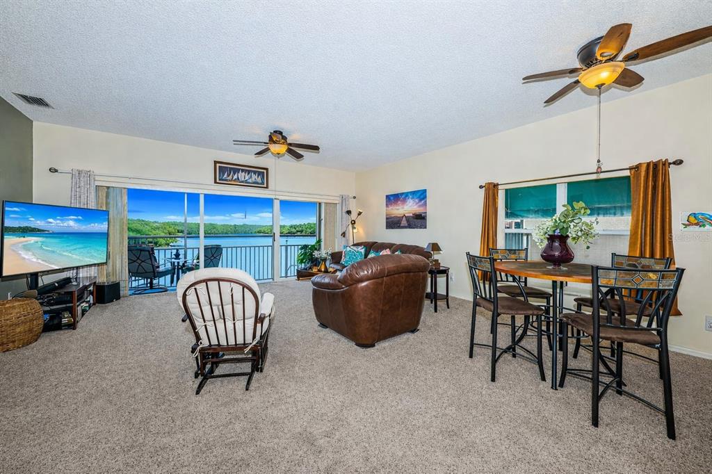 6363 99th Way North, Unit 12I St. Petersburg, FL 33708 - Photo 13 of 69 a view of a dining room with furniture window and outside view