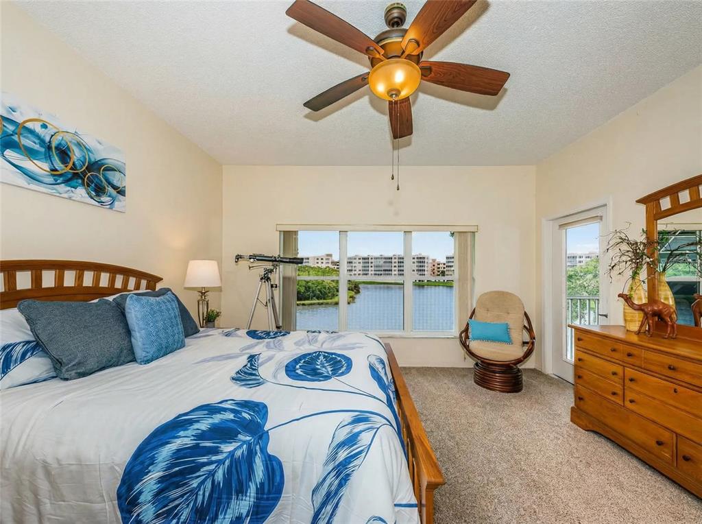 6363 99th Way North, Unit 12I St. Petersburg, FL 33708 - Photo 27 of 69 a bedroom with a bed and furniture