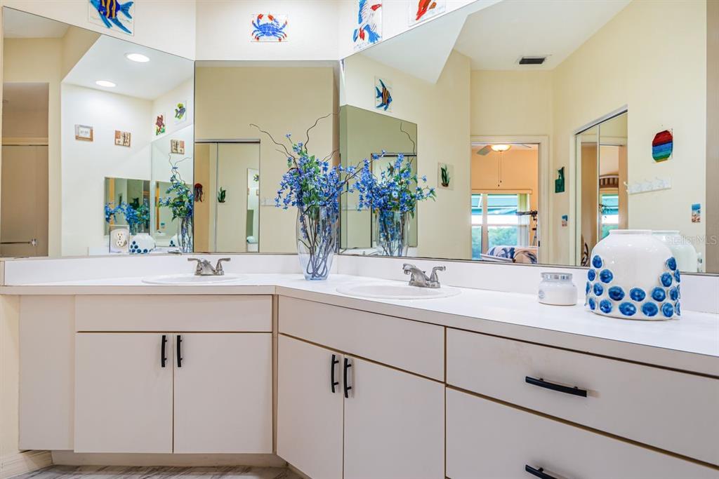 6363 99th Way North, Unit 12I St. Petersburg, FL 33708 - Photo 29 of 69 a bathroom with a sink and a mirror