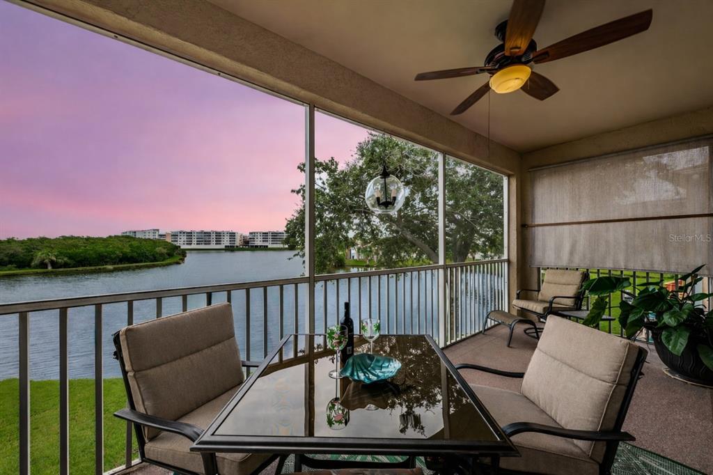 6363 99th Way North, Unit 12I St. Petersburg, FL 33708 - Photo 3 of 69 a balcony with furniture and a potted plant