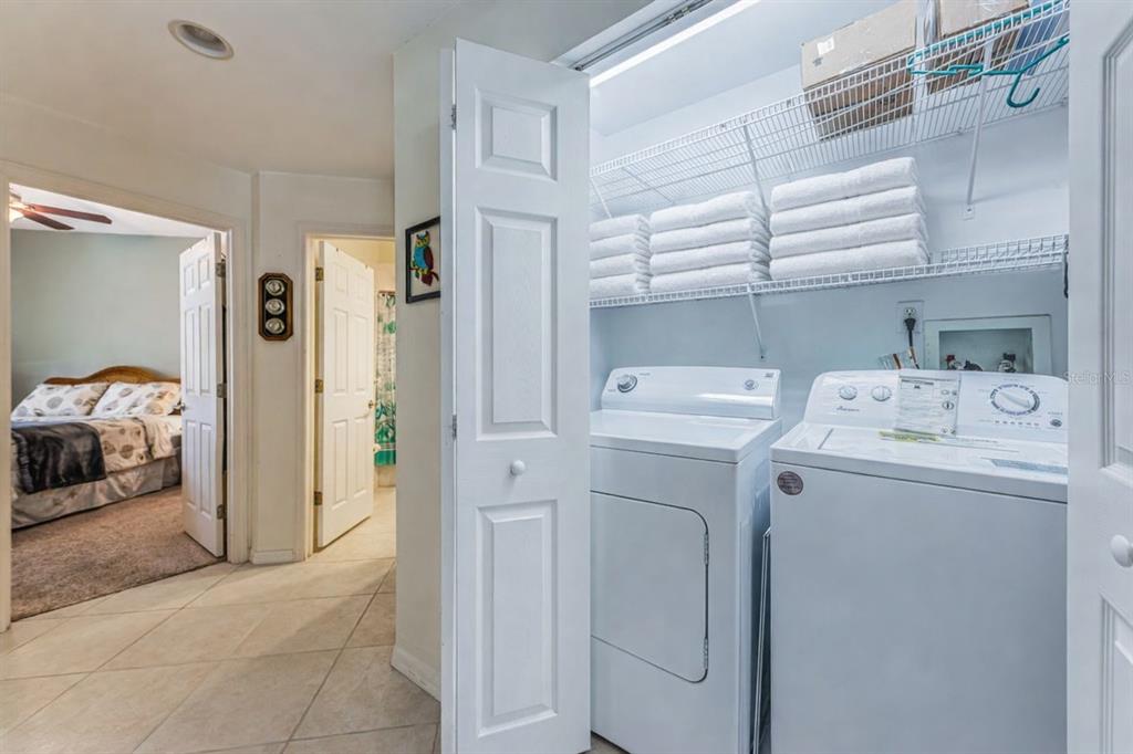 6363 99th Way North, Unit 12I St. Petersburg, FL 33708 - Photo 34 of 69 a view of storage and utility room with washer and dryer