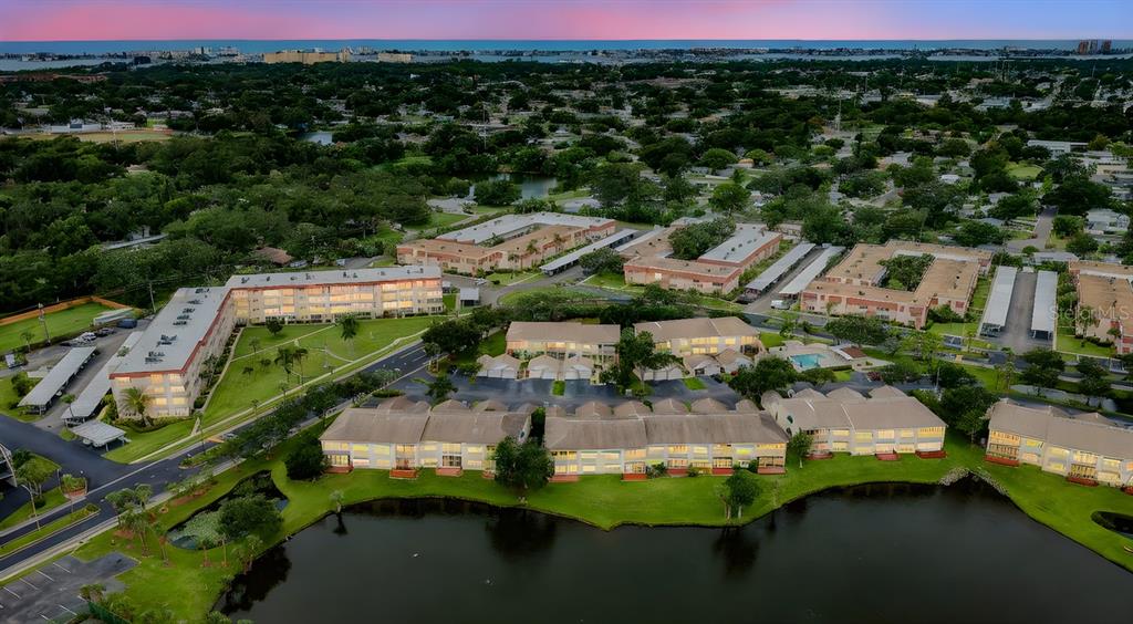 6363 99th Way North, Unit 12I St. Petersburg, FL 33708 - Photo 43 of 69 an aerial view of a house with a yard basket ball court and outdoor seating