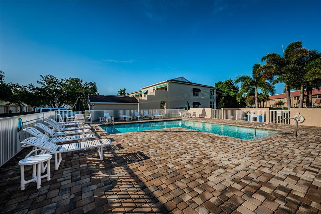 6363 99th Way North, Unit 12I St. Petersburg, FL 33708 - Photo 58 of 69 a view of a backyard