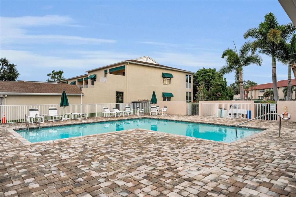 6363 99th Way North, Unit 12I St. Petersburg, FL 33708 - Photo 60 of 69 a front view of a house with garden