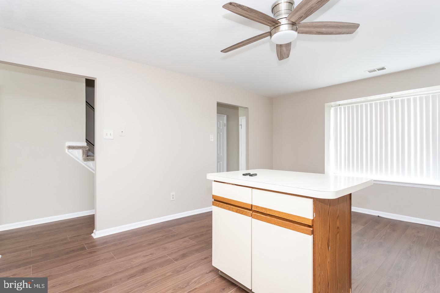 118 Caernarvon Court Exton, PA 19341 - Photo 11 of 36 a room with a ceiling fan and wooden floor