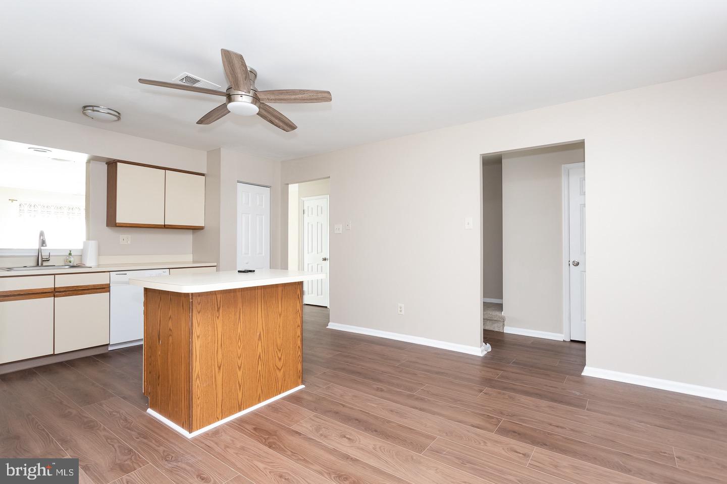 118 Caernarvon Court Exton, PA 19341 - Photo 13 of 36 a kitchen with granite countertop white cabinets and wooden floor