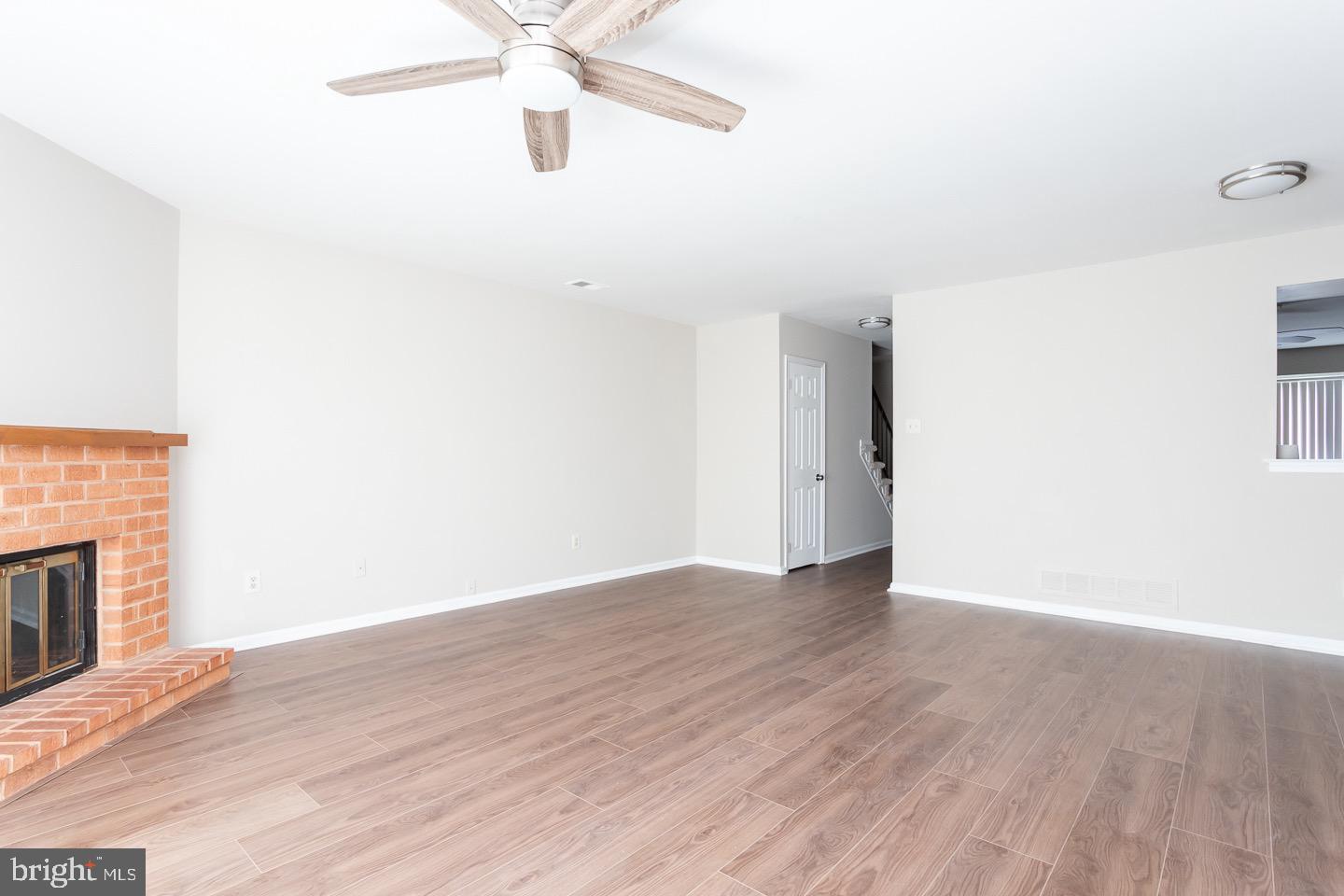 118 Caernarvon Court Exton, PA 19341 - Photo 18 of 36 a view of an empty room with wooden floor