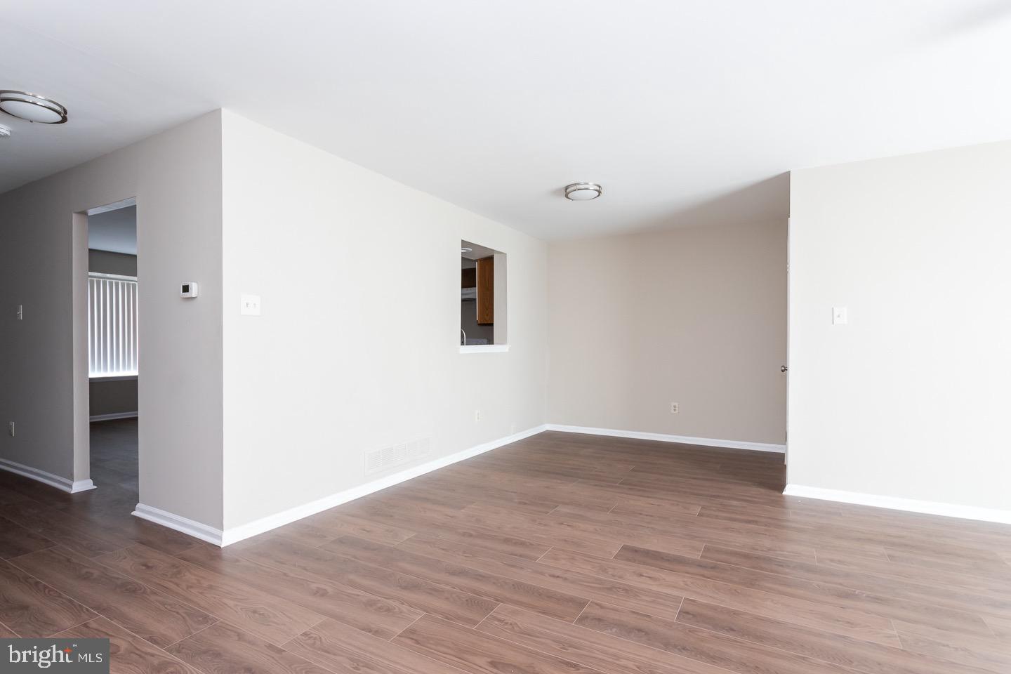 118 Caernarvon Court Exton, PA 19341 - Photo 19 of 36 a view of an empty room with wooden floor