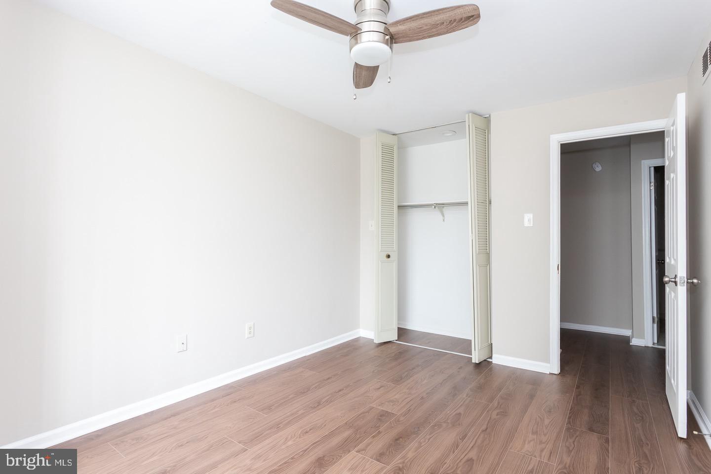 118 Caernarvon Court Exton, PA 19341 - Photo 27 of 36 a view of a room with wooden floor and ceiling fan
