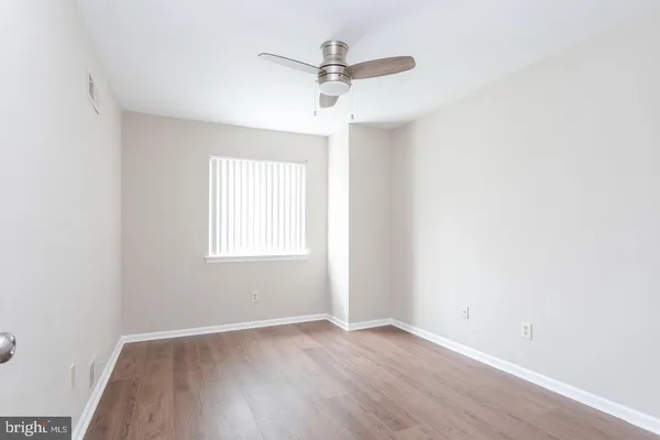 a bathroom with a sink shower and a mirror