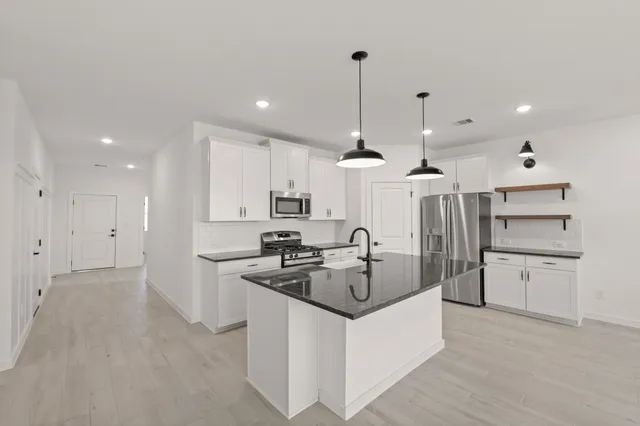 a living room with furniture and a table