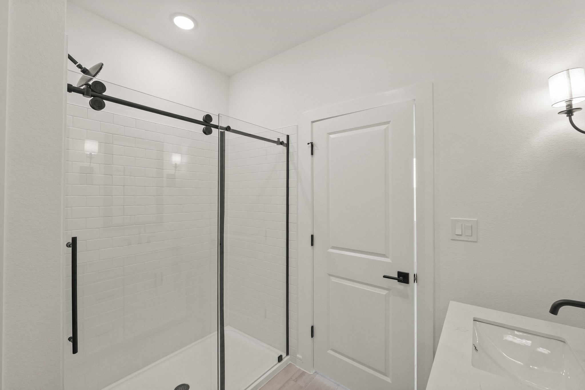 7815 Jade Crest Drive Angleton, TX 77515 - Photo 24 of 38 a bathroom with a shower and a glass door