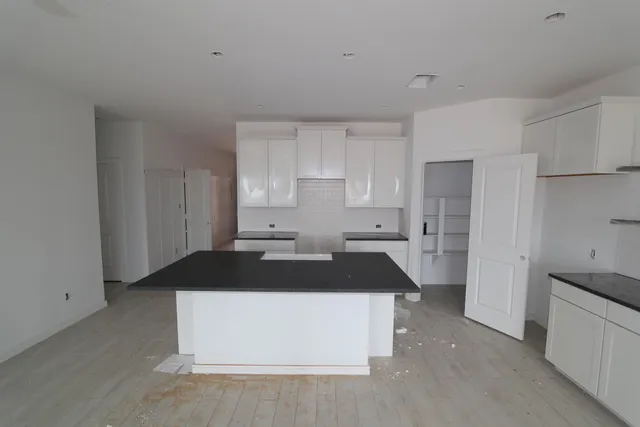 a kitchen that has a sink and a stove in it