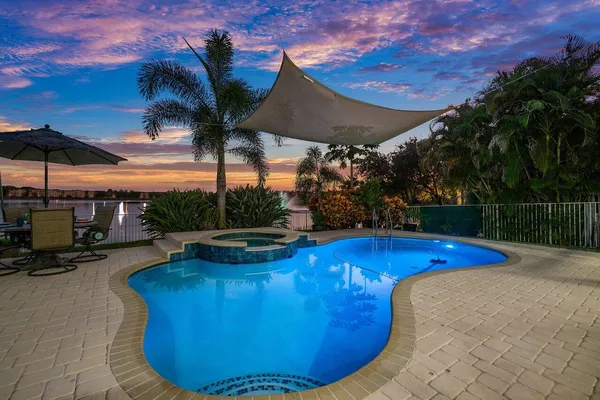 a view of a swimming pool with a patio