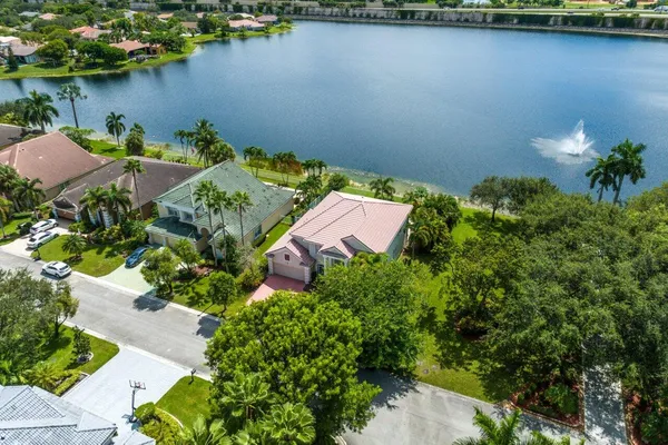 an aerial view of a house with a lake view
