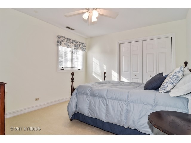 5600 South County Line Road Hinsdale, IL 60521 - Photo 19 of 24 a bedroom with a bed and a window