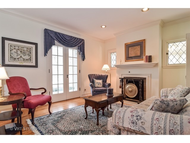 5600 South County Line Road Hinsdale, IL 60521 - Photo 3 of 24 a living room with furniture and a fireplace
