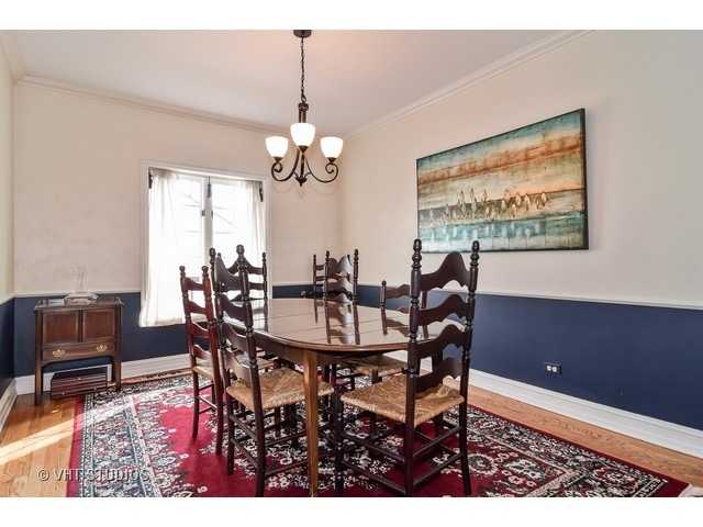 5600 South County Line Road Hinsdale, IL 60521 - Photo 6 of 24 a view of a dining room with furniture and chandelier