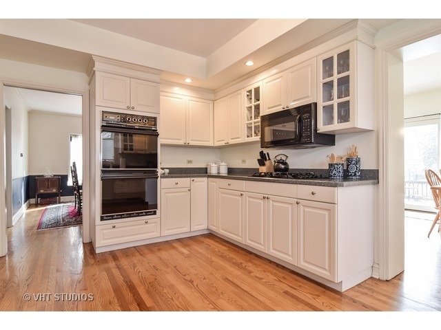 5600 South County Line Road Hinsdale, IL 60521 - Photo 8 of 24 a kitchen with stainless steel appliances granite countertop a refrigerator and a stove top oven