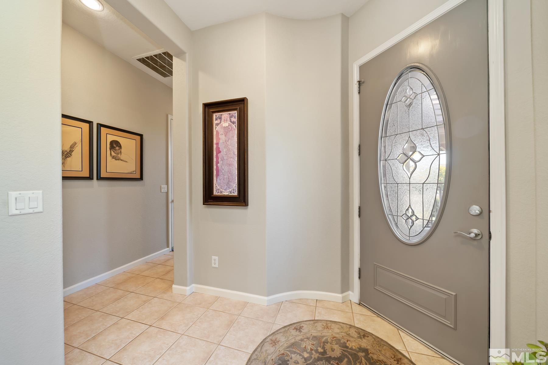 1631 Brightstone Court Reno, NV 89521 - Photo 11 of 40 a front view of a house with large mirror