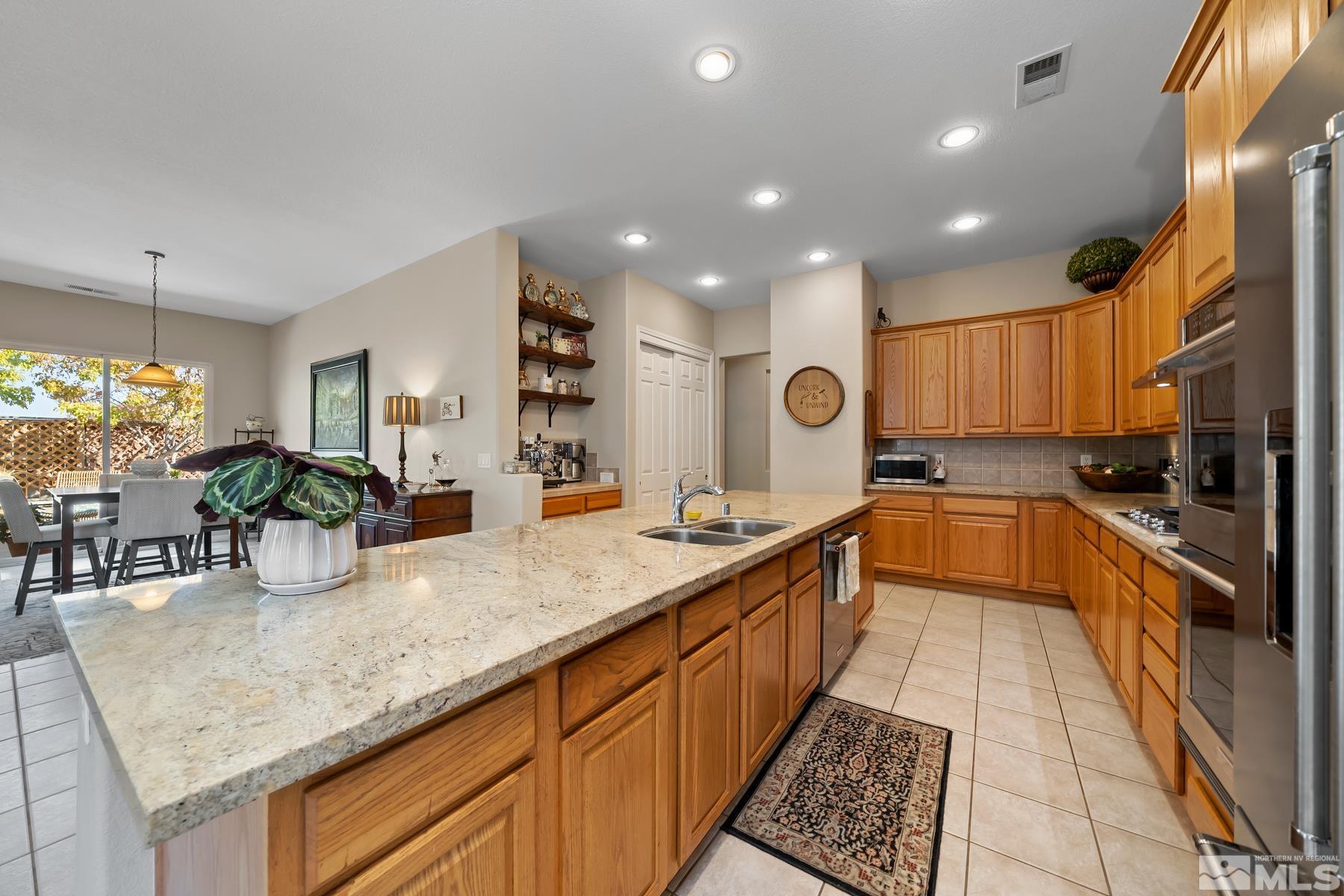 1631 Brightstone Court Reno, NV 89521 - Photo 18 of 40 a kitchen with granite countertop lots of counter top space