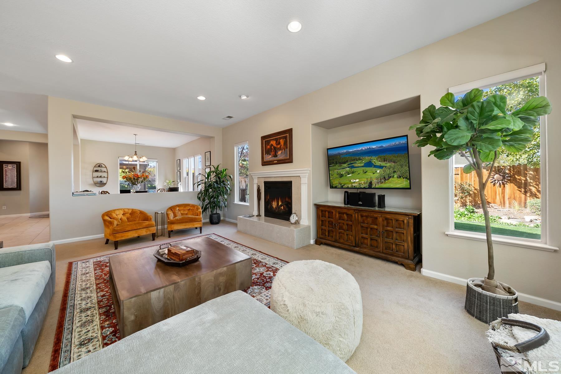 1631 Brightstone Court Reno, NV 89521 - Photo 24 of 40 a bedroom with furniture and a fireplace