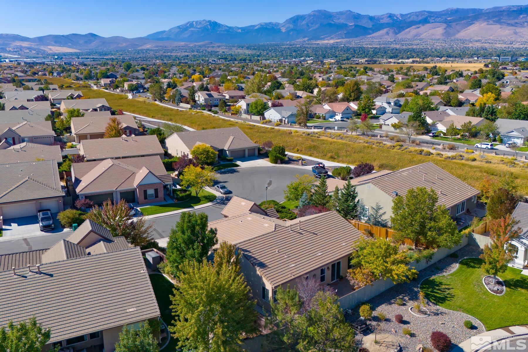 1631 Brightstone Court Reno, NV 89521 - Photo 3 of 40 an aerial view of residential houses and outdoor space