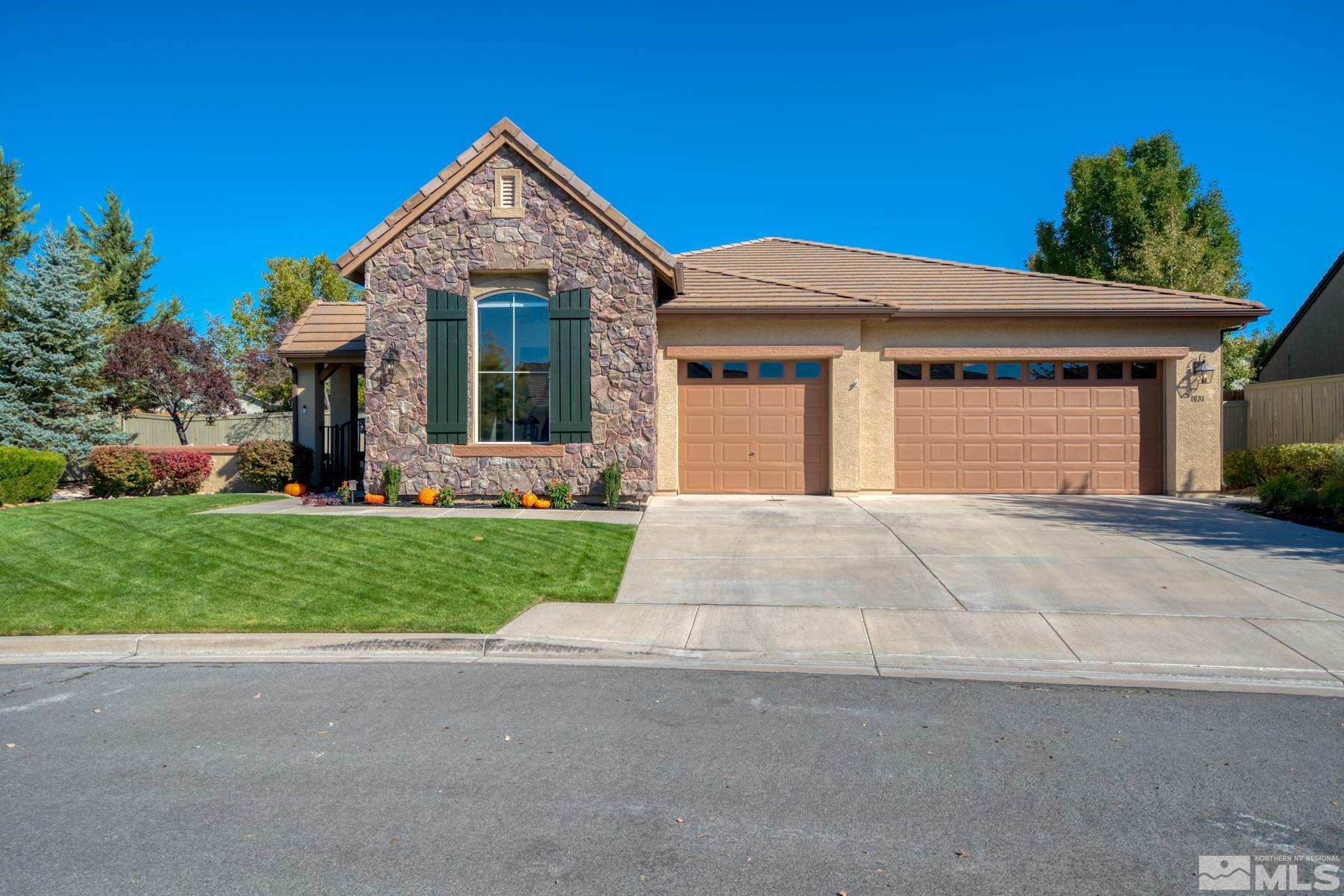1631 Brightstone Court Reno, NV 89521 - Photo 40 of 40 a front view of a house with a yard and garage