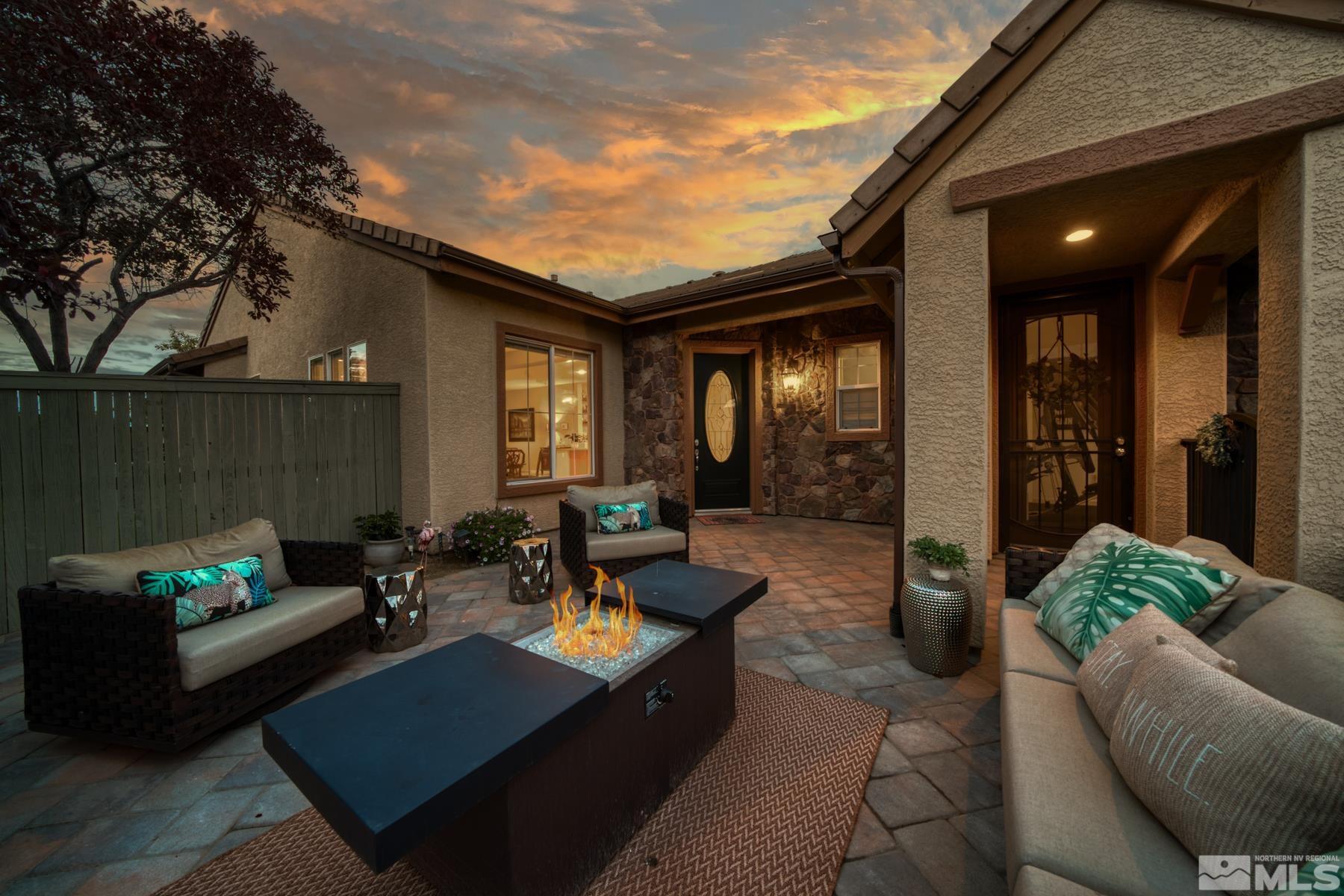 1631 Brightstone Court Reno, NV 89521 - Photo 8 of 40 a outdoor living space with furniture and a fireplace