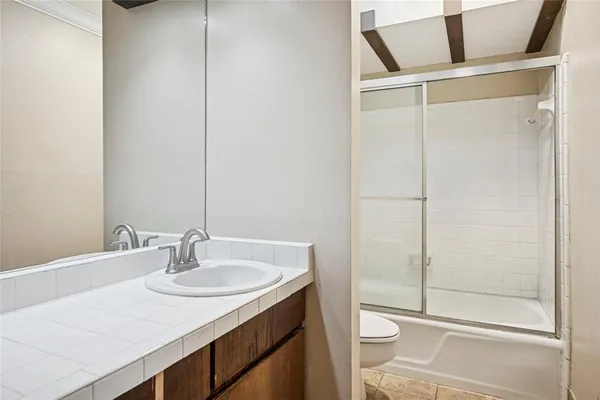 a view of backyard of house with green space