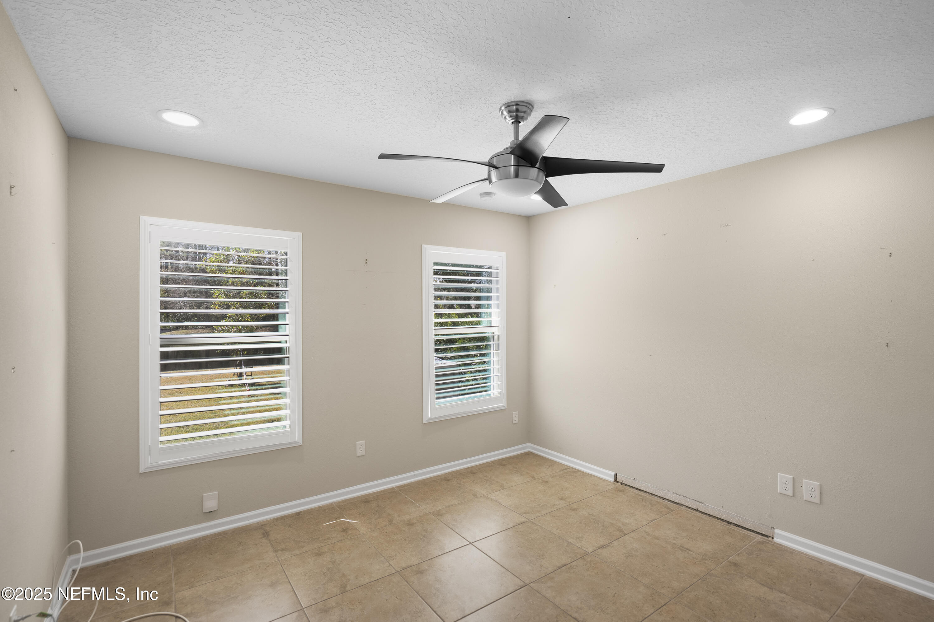 230 Timberwood Drive St. Augustine, FL 32084 - Photo 17 of 34 a view of an empty room with a window