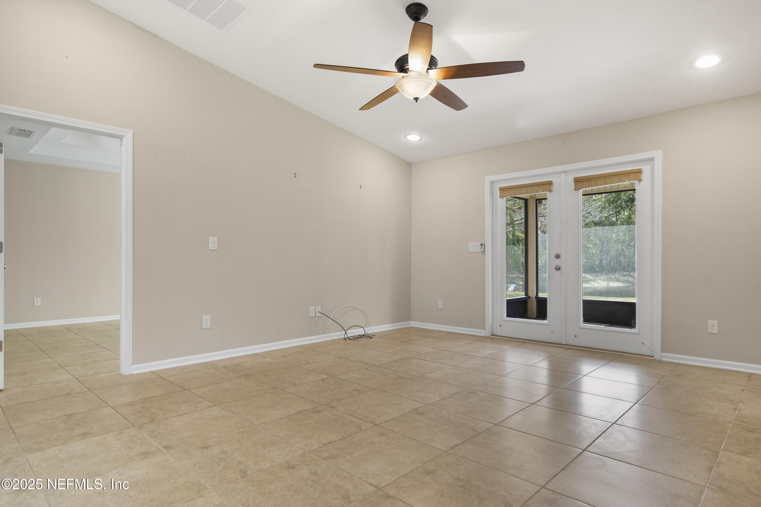 230 Timberwood Drive St. Augustine, FL 32084 - Photo 21 of 34 a view of an empty room with a window