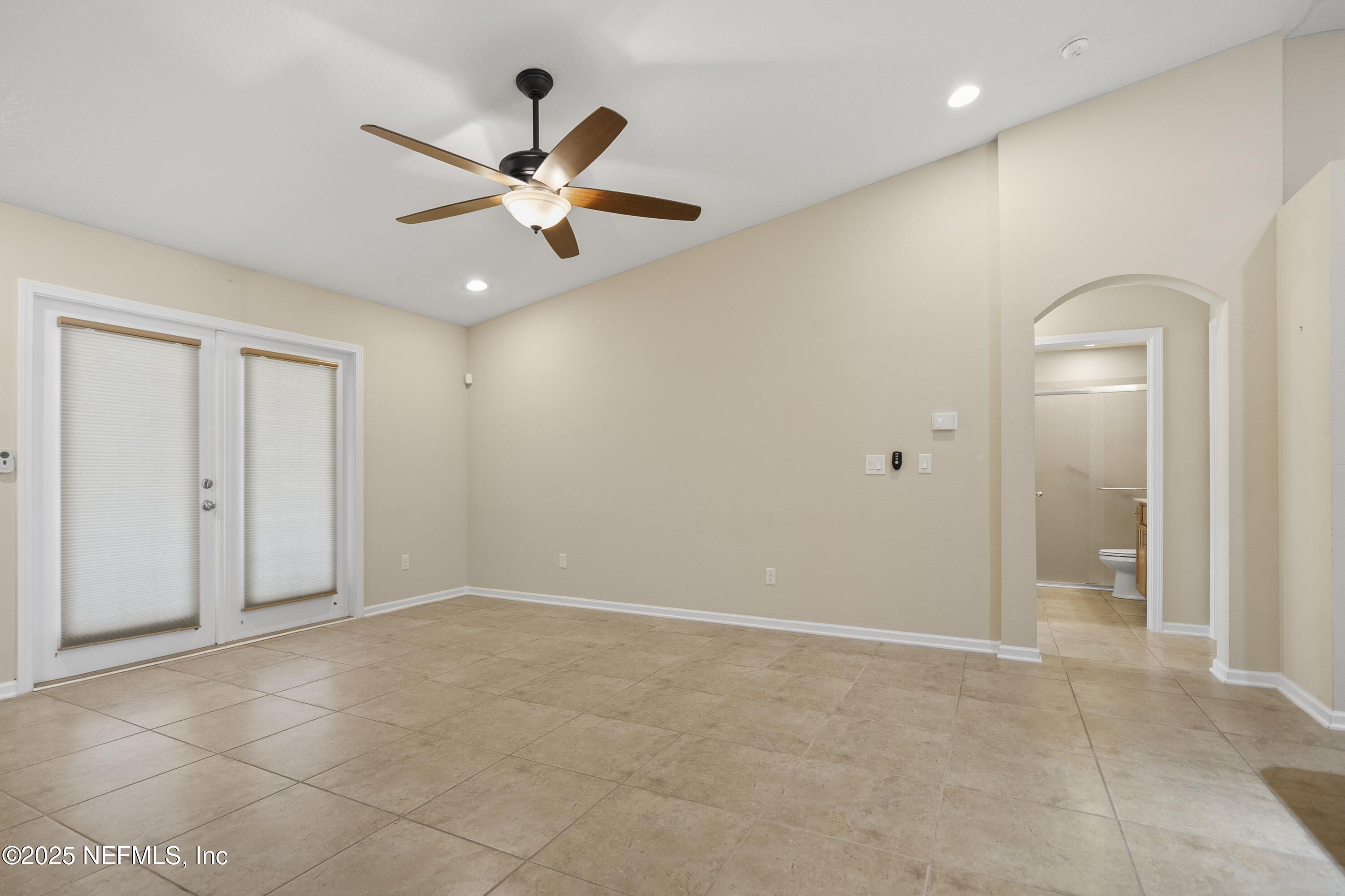 230 Timberwood Drive St. Augustine, FL 32084 - Photo 22 of 34 an empty room with a ceiling fan and a window