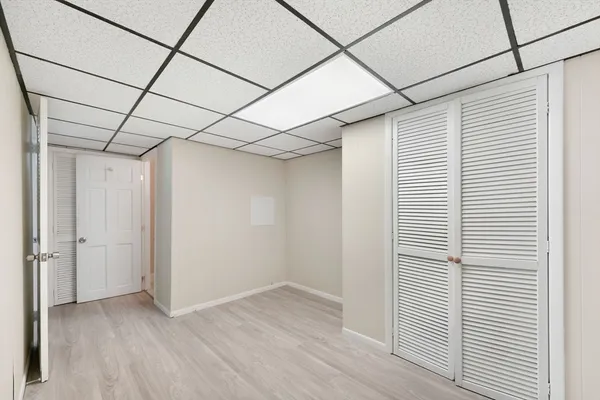 a view of a room with wooden floor