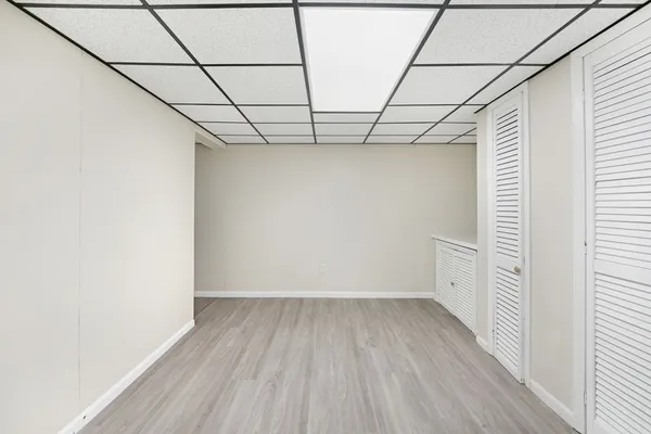 a view of a room with wooden floors and led lights