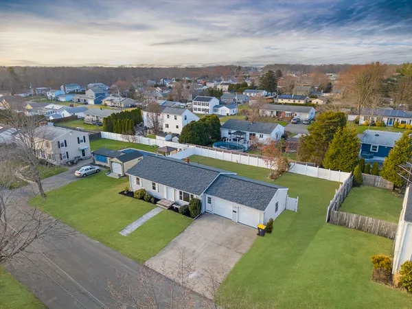 an aerial view of a house with a garden
