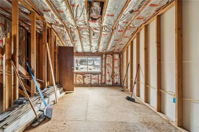 a view of an empty room with windows