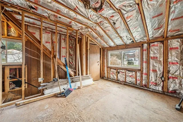 a view of an empty room with windows