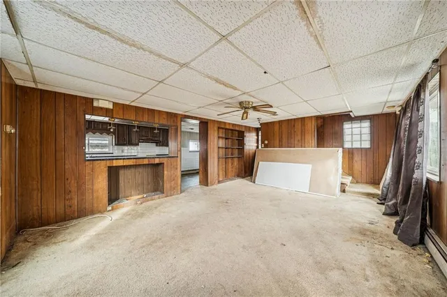 a room with a bed and a large window